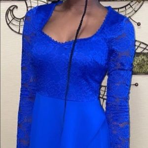 This is a royal blue long sleeve short dress, it is a size 5!